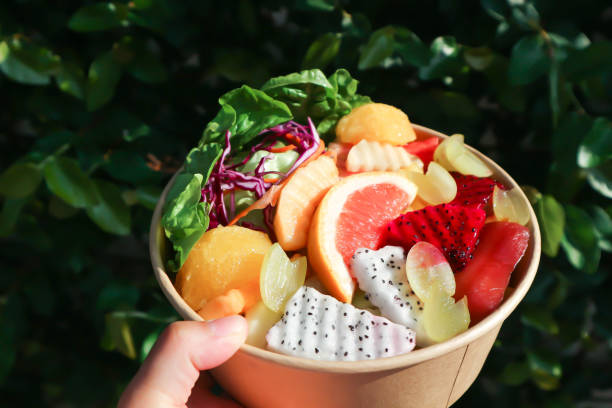 istock fruit and vegetable salad or orange, dragon fruit and lettuce salad 1494037806