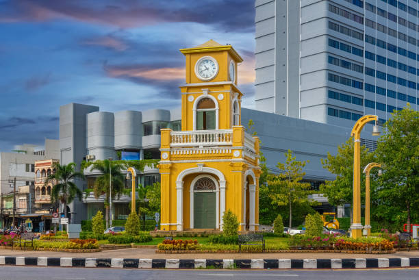 istock Clock tower on a roundabout in old phuket town at during the summer day surrounded by high-rise buildings and Hotels in phuket thailand. 1494038513