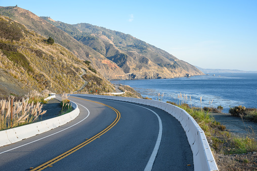 Deserted stretch of Pacific coast highway one along the rugged coast of California near Big Sur on a clear autumn day