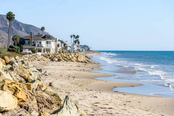 istock Modern oceanfront houses on a sandy beach on a clear autumn day 1494042852