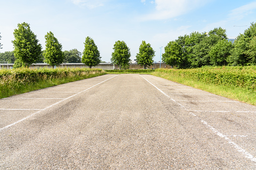 Empty parking spaces at a park and ride facility on a sunny summer day. Zoetermeer, Netherlands.