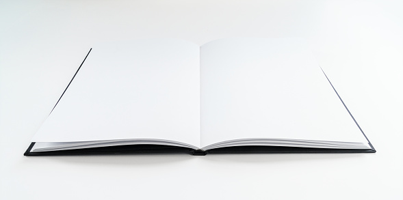 Blank Fresh Slate Open Book - Book opened with white empty pages. Art sketchbook with nothing in it opened to middle.
