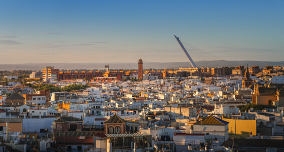 Seville Skyline at sunset with Alamillo Bridge and Perdigones Tower - Seville, Andalusia, Spain
