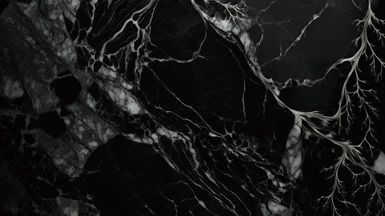 Black Luxury Marble with gold lines background texture. Slow and panoramic motion. High detailed 4K video.  Marble pattern texture surface panning background. Marble stone texture.