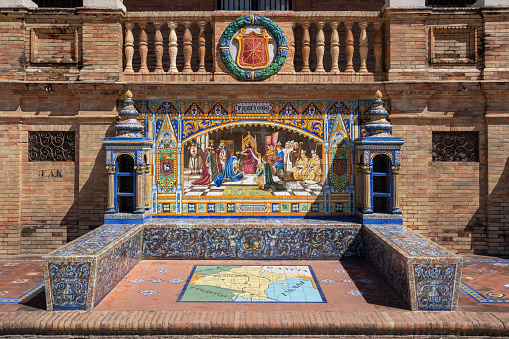 Seville, Spain - Apr 5, 2019: Alcove with bench and tiles representing Pamplona Province - Seville, Andalusia, Spain