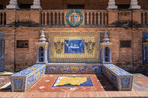 Seville, Spain - Apr 5, 2019: Alcove with bench and tiles representing Salamanca Province - Seville, Andalusia, Spain