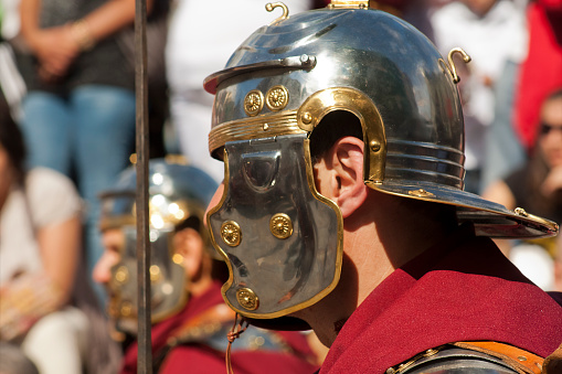 Lugo, Galicia, Spain - June 14th 2014: Side view of a roman soldier, close up with helmet . Parade in  Arde Lucus festival, Historical reenactment, Lugo city, Galicia, Spain..