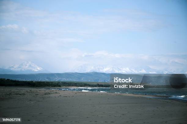 Beach Of Salt Lake With Mountain Ridge And Cloudscape On The Background Stock Photo - Download Image Now