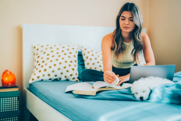istock Young woman studying at home 1494058291