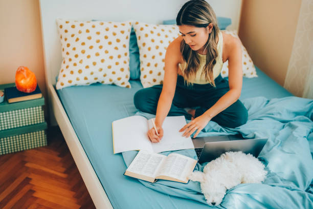 istock Young woman studying at home 1494058340