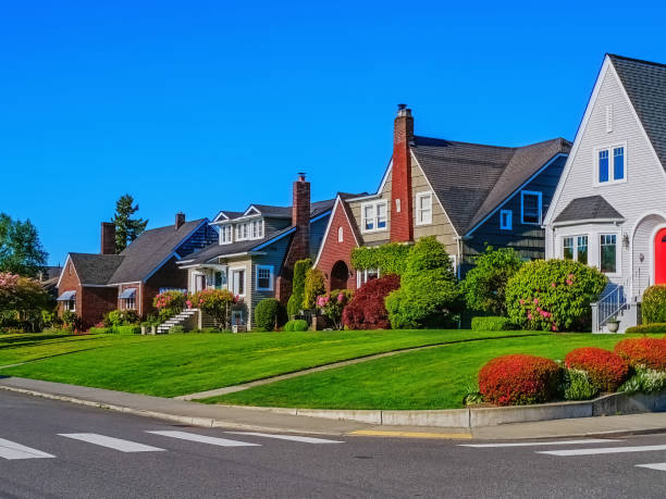 Diminishing Perspective View of Historic House Exteriors Photo of a row of historic home exteriors on a sunny spring day with clear blue sky old suburban neighborhood stock pictures, royalty-free photos & images