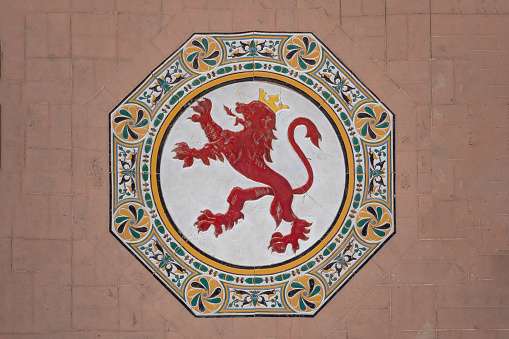 Seville, Spain - Apr 5, 2019: Tiles with Leon Coat of Arms at Plaza de Espana - Seville, Andalusia, Spain