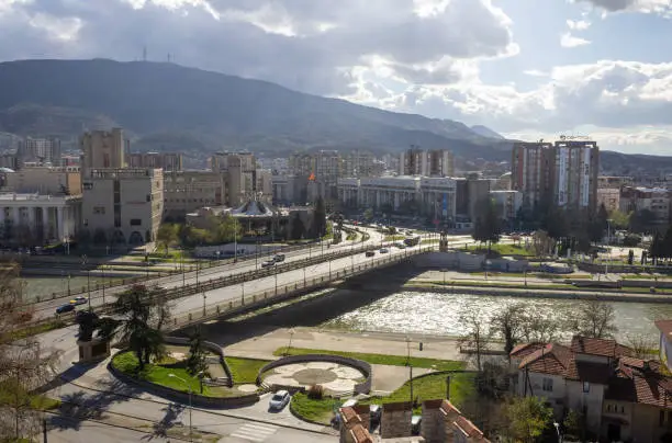 The citiview of Skopje, the capital city of the North Macedonia with a bridge over the Vardar river