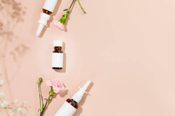 istock Nasal drops, moisturizing spray and oil on pink background with copy space 1494063933