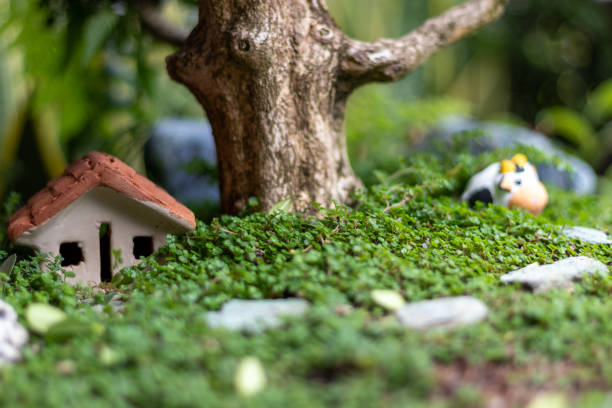 istock Farm in ceramic representation, a house ,cow and big tree 1494064392