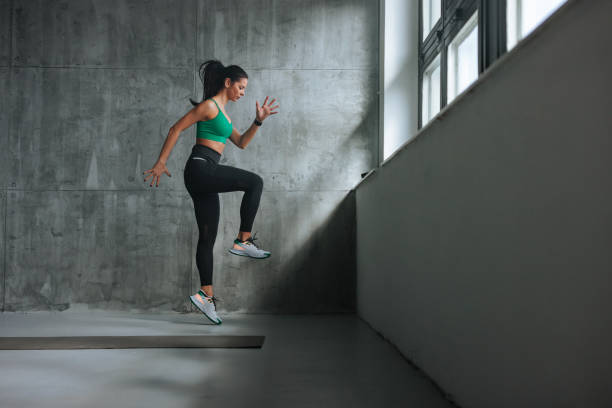 istock Athletic girl jumping during exercise. 1494066698