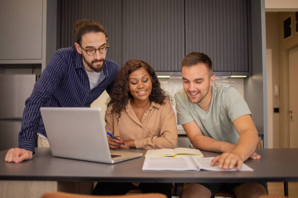 istock Diverse group of students are learning online from their dormitory 1494069983