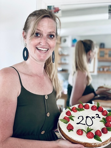 Woman shows the 40th birthday cake