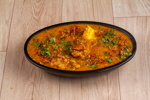 mutton khichda or Haleem in bowl on wooden background. indian food.