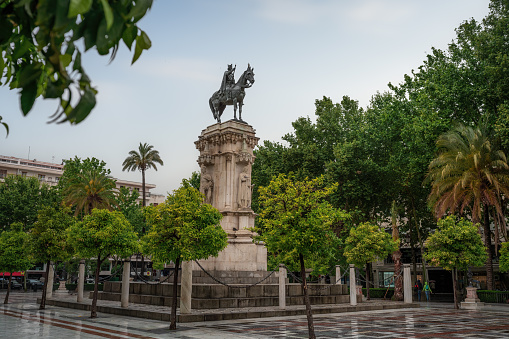 Seville, Spain - Apr 7, 2019: San Fernando Monument at Plaza Nueva Square - Seville, Andalusia, Spain