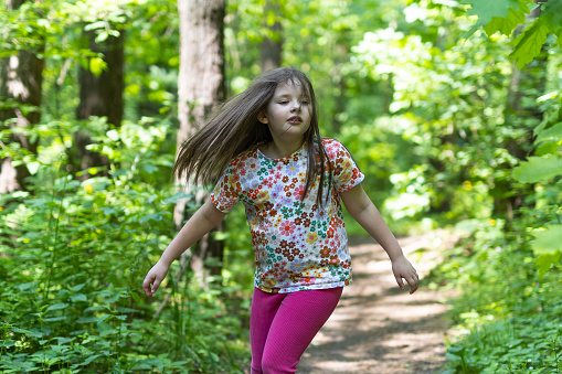 Only One Young Girl Walking in the Forest near Cracov. Poland.