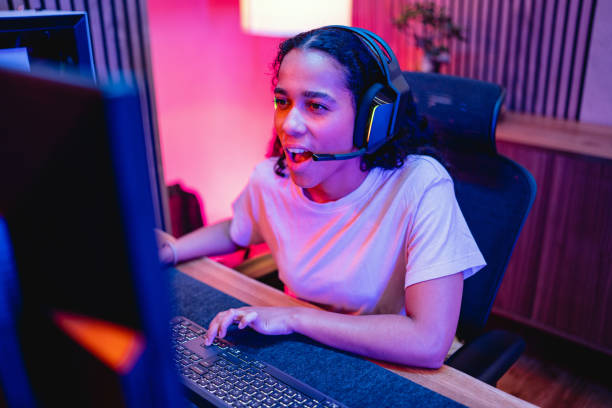 istock Young Adult Hispanic Female Gamer Playing On A Computer 1494088861
