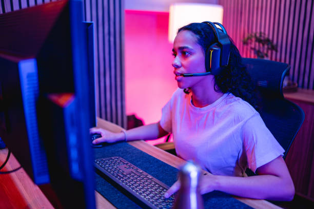 istock Young Adult Hispanic Female Gamer Playing On A Computer 1494088872