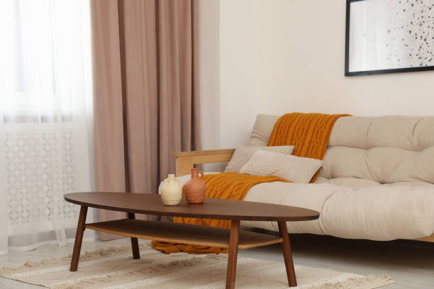 istock Living room with pastel window curtain, wooden table and sofa 1494092880