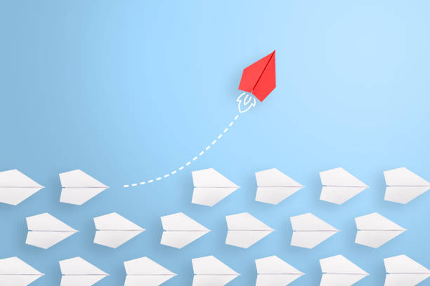 istock Change concepts with red paper airplane leading among white 1494094478