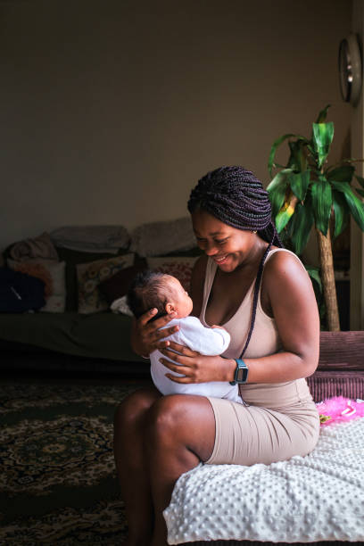 istock African mother embracing a newborn at home 1494097622