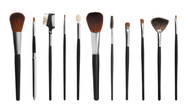 istock Set with different makeup brushes for applying cosmetic products on white background. Banner design 1494104372