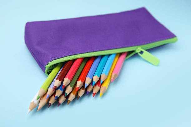 istock Many colorful pencils in pencil case on light blue background, closeup 1494104417
