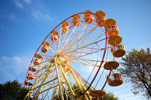 Ferris wheel at evening blue sky