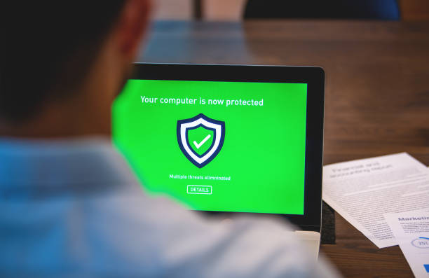 istock Businessman looking at a antivirus security log in screen on a computer 1494114508