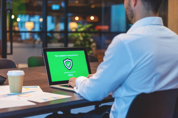 Businessman looking at a antivirus security log in screen on a computer