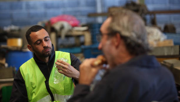 istock Plant engineers sitting and eating lunch 1494122201