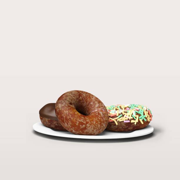 istock Bunch of delicious donuts on white plate isolated on white. 1494122530
