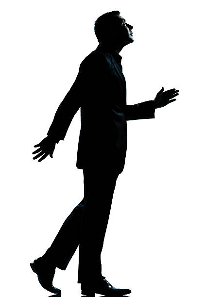 istock one business man walking looking up silhouette 149412254