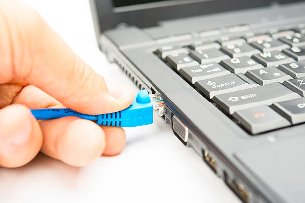 istock Connecting of internet cable to the notebook 149412349