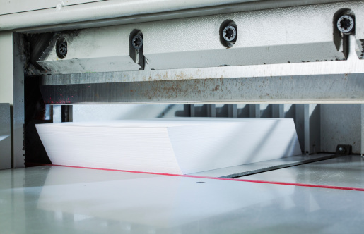 Paper ready to be cutted in an automatic paper trimmer