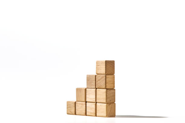 istock Wood cube arranged stacked as stair step shapes, a business concept 1494124629