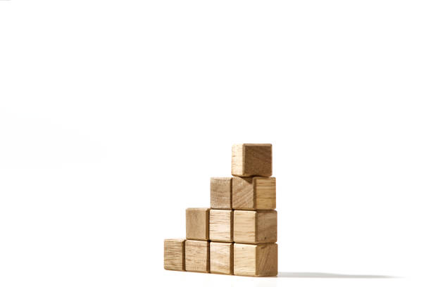 istock Wood cube arranged stacked as stair step shapes, a business concept 1494124631