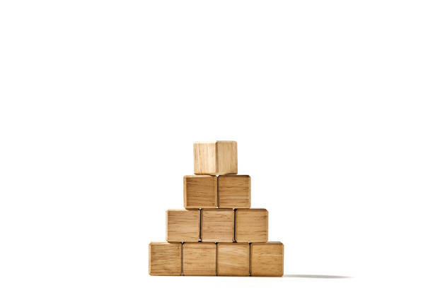 istock Wood cubes arranged in the pyramid shape on white 1494125953