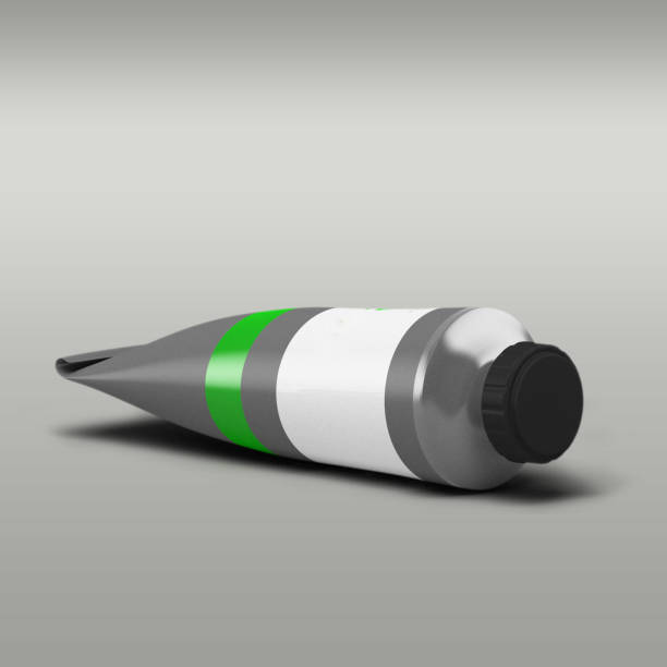 istock Green tube paint pasta isolated on grey background. 1494128341
