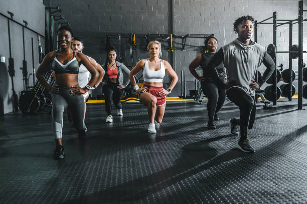 istock Multiracial group of athletes training on lunges in gym 1494134869