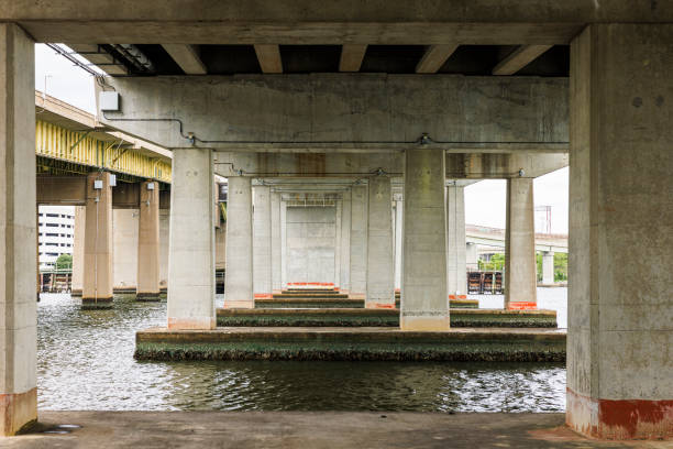 istock Geometry design of columns and bridge piers on Elizabeth river. View under Berkley Bridge on Elizabeth River in Norfolk, VA 1494136480