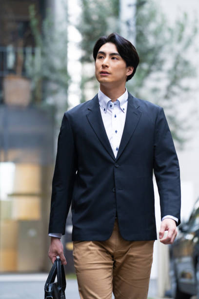 istock Japanese man in suit going to work 1494139693