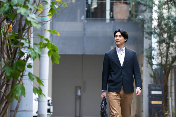 istock Japanese man in suit going to work 1494139710