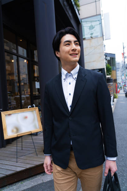 istock Japanese man in suit going to work 1494139896