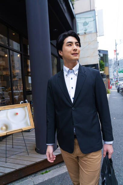 istock Japanese man in suit going to work 1494139909